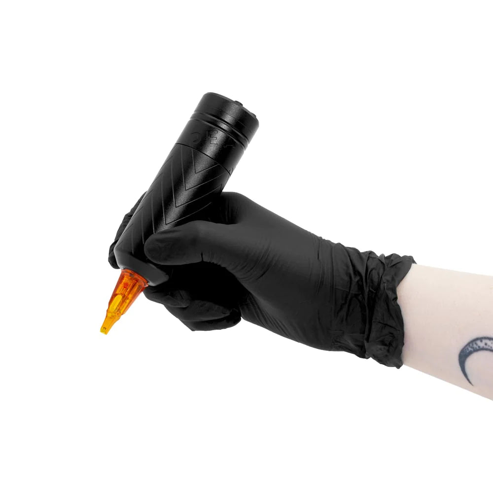 Artist's Hand Gripping the Wireless Tattoo Power Pen